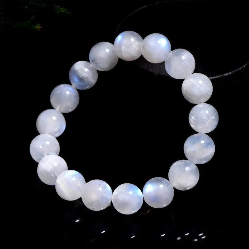 Blue moonlight polished moonstone bead bracelet with round beads in geometric arrangement