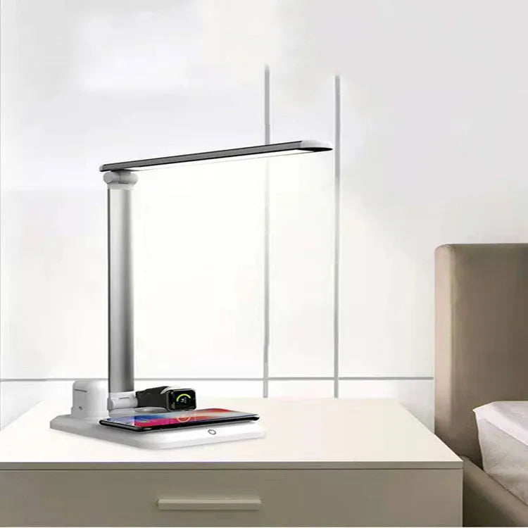 Black and white 4-in-1 LED desk lamp with wireless charging pad and adjustable lighting controls