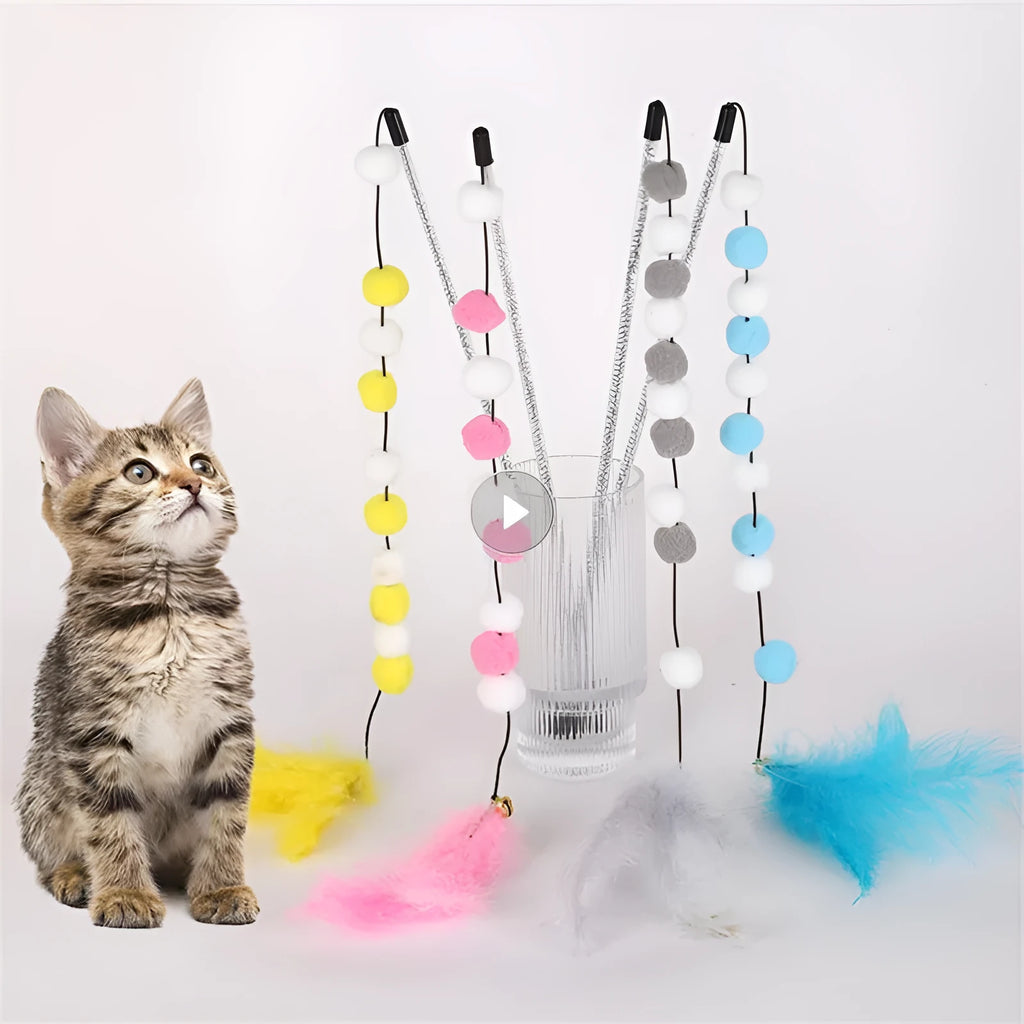 Grey and yellow cat teaser stick with a bell and a pompon feather, shown next to a blue and pink version.