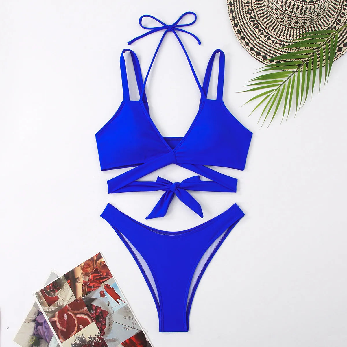 Women's solid colour strap bikini swimsuit in a brief style on a white background.
