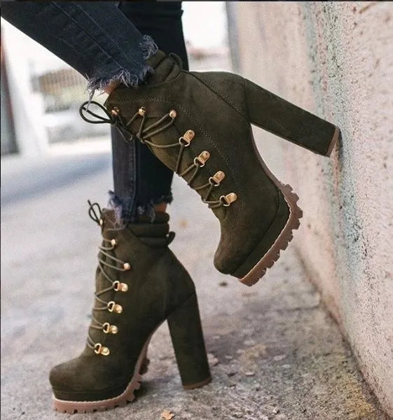 Women's suede ankle boots with a thick high heel and platform sole in four colour choices.
