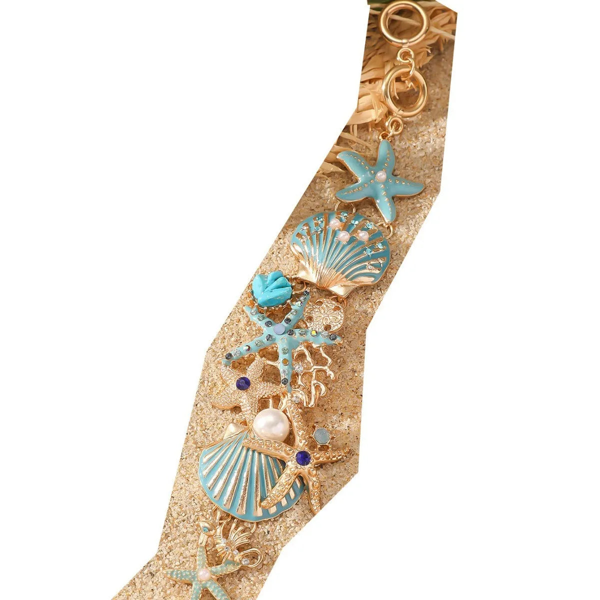Women's alloy rhinestone bracelet with boat anchor, shell, and starfish charms in blue.