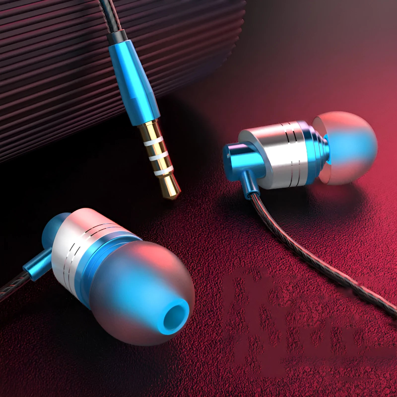 Black wired in-ear headphones with a 3.5mm plug, built-in microphone on the cable, and silicone earpieces.