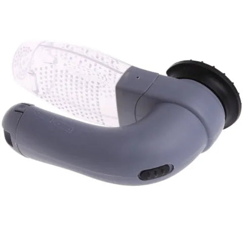 Grey portable pet hair vacuum cleaner with soft rubber head and large collection canister on a fabric sofa.