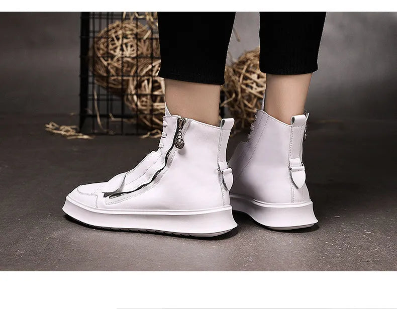 Man wearing black PU leather high-top sneaker style winter ankle boots.