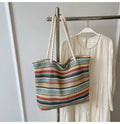 Blue straw woven large capacity nylon shoulder bag with a single strap.