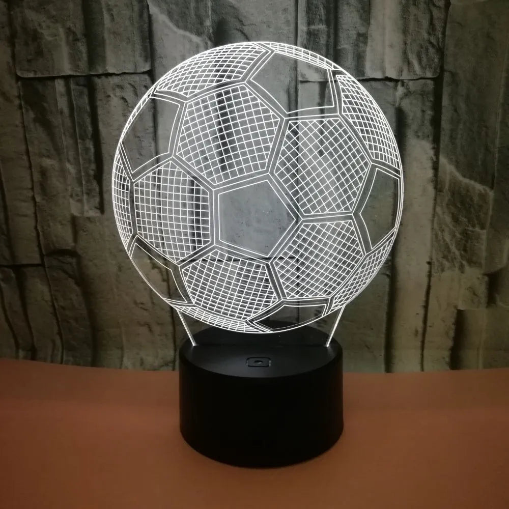 3D acrylic football night light showing red LED colour, with USB cable and remote control.