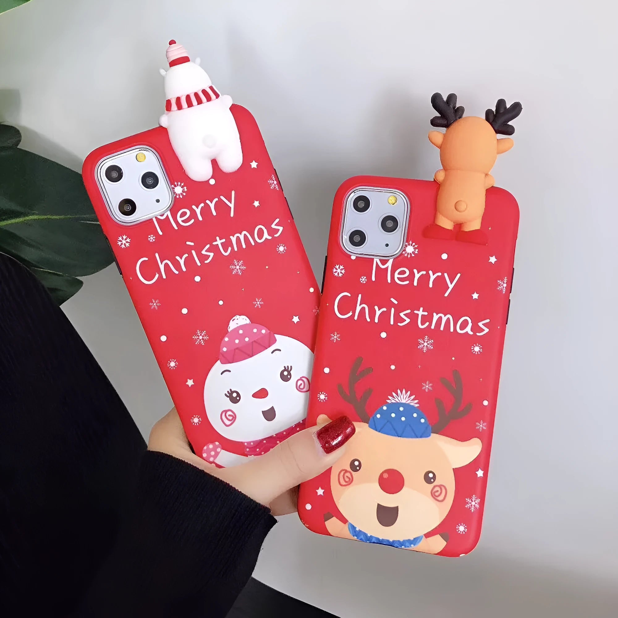 Red Christmas-themed silicone phone case on an iPhone, showing festive back cover design.