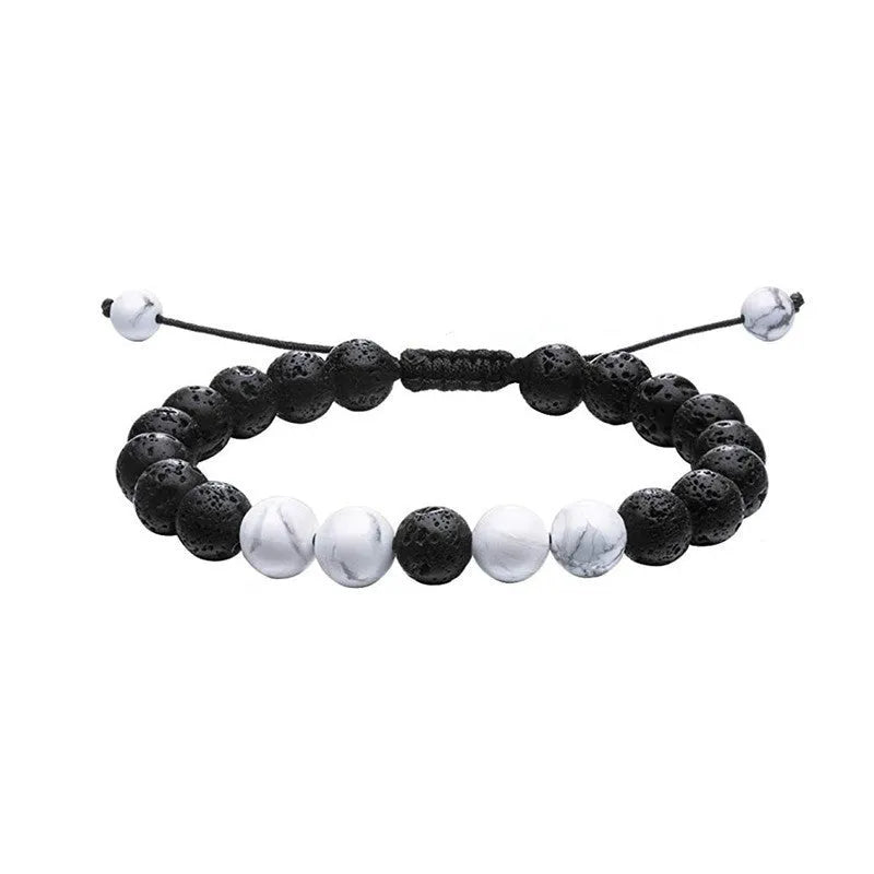 Geometric couple bracelet made of matte black agate beads with a tiger eye stone.