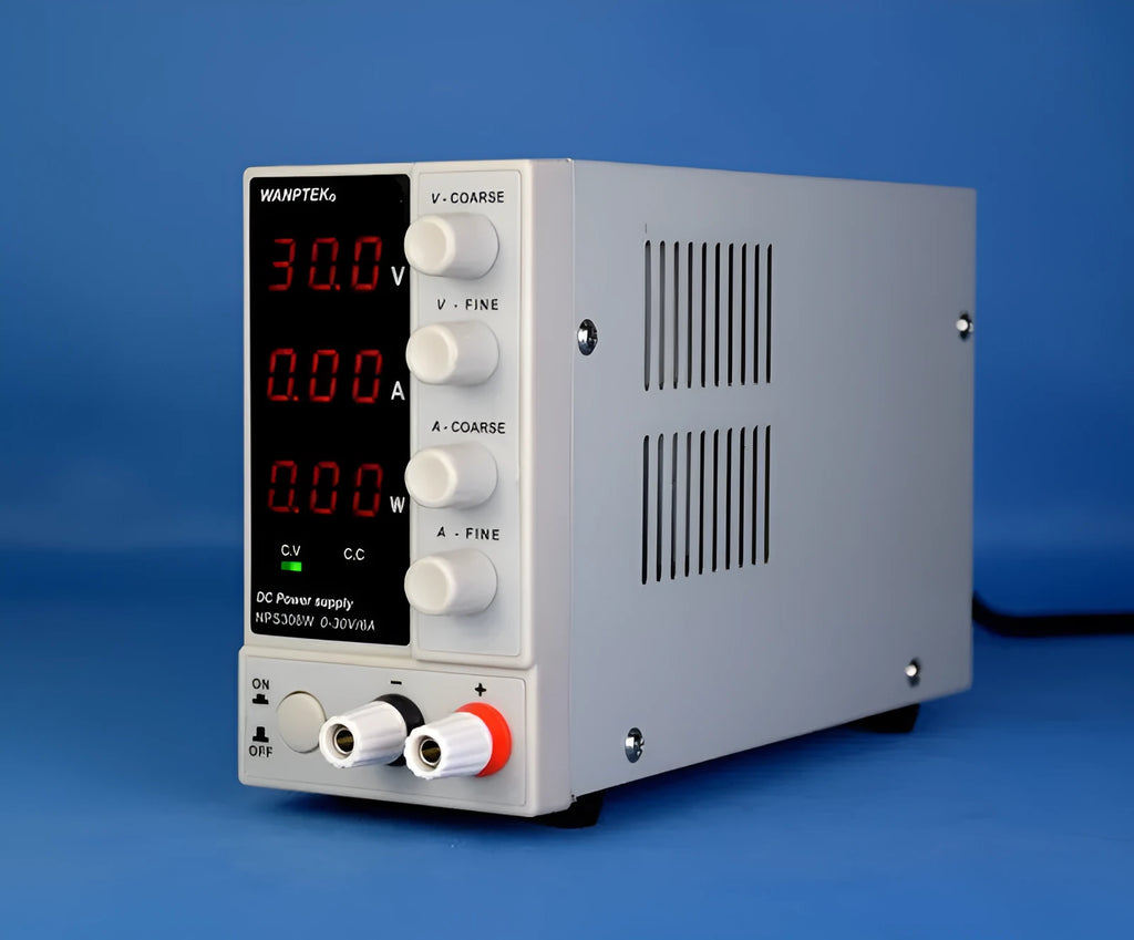 White adjustable DC bench power supply model NPS605W with voltage and current control dials.