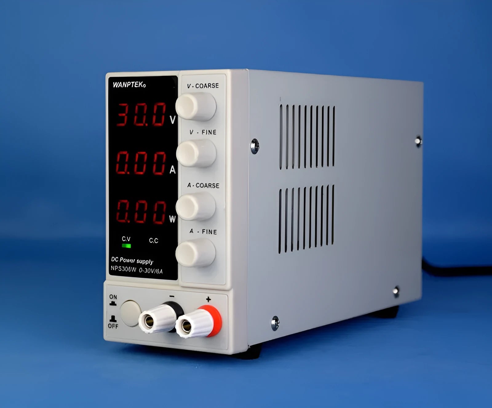 White adjustable DC bench power supply model NPS605W with voltage and current control dials.