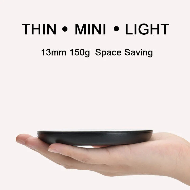 Black circular USB cup warmer pad with a tempered glass surface and dual temperature switch