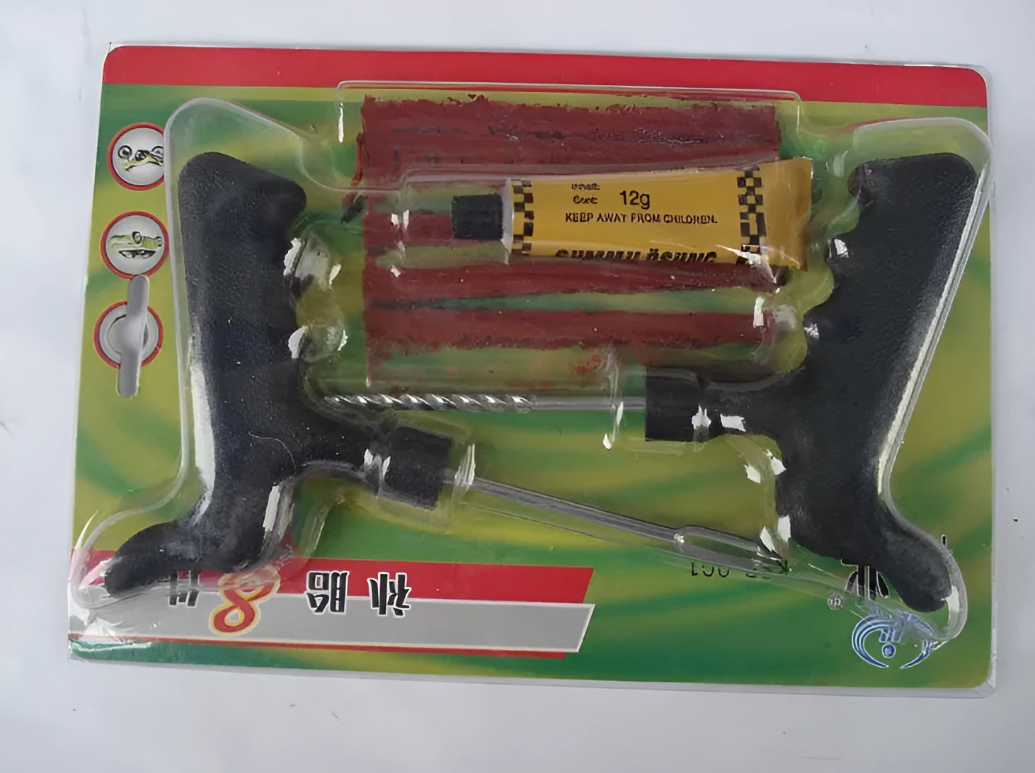 Black and yellow vacuum tyre repair tool kit with probe, pin, glue, and rubber strips.