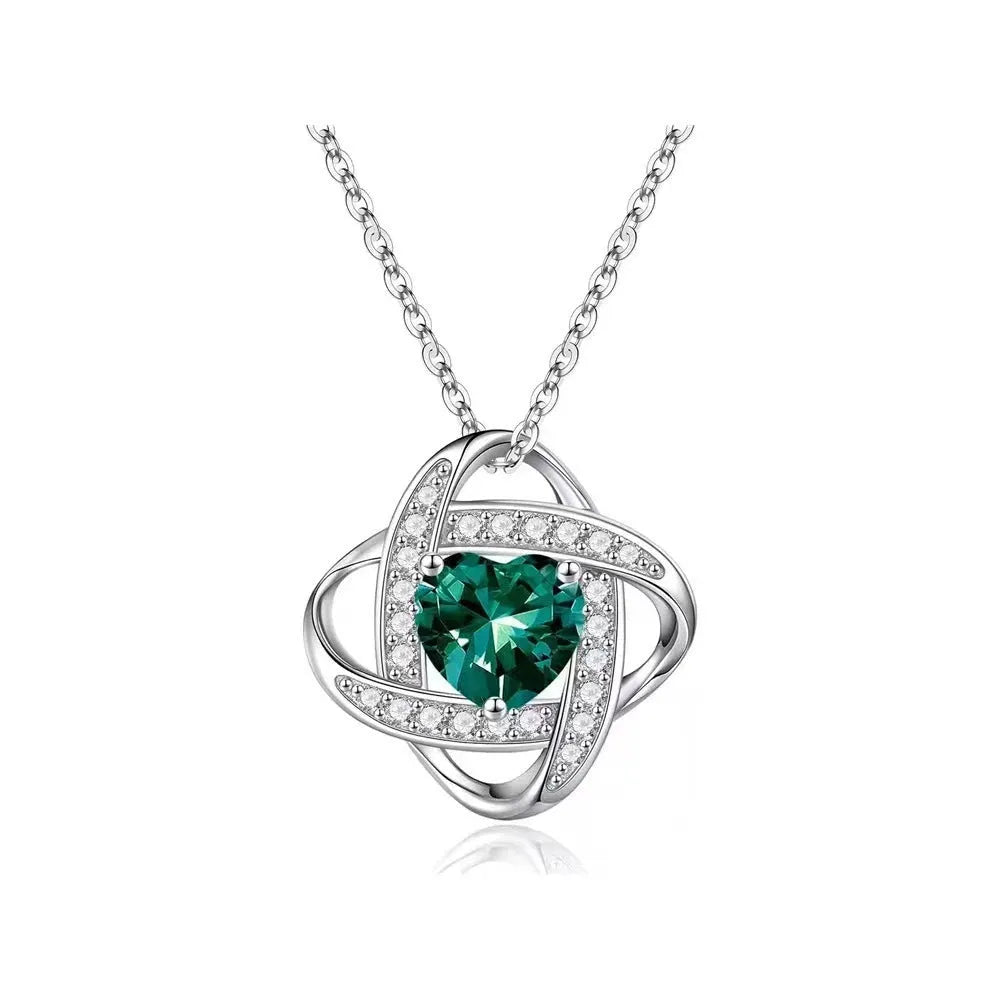 Copper heart necklace with electroplated platinum finish showing multiple colour variations