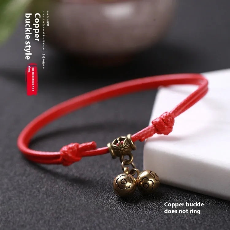 A nylon rope dog collar with brass fittings, shown in black, red, and coffee colours.
