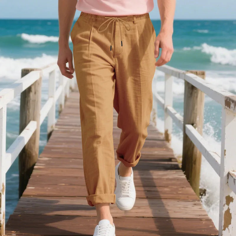 Men's light khaki linen casual trousers with a loose straight-leg fit and drawstring waist.
