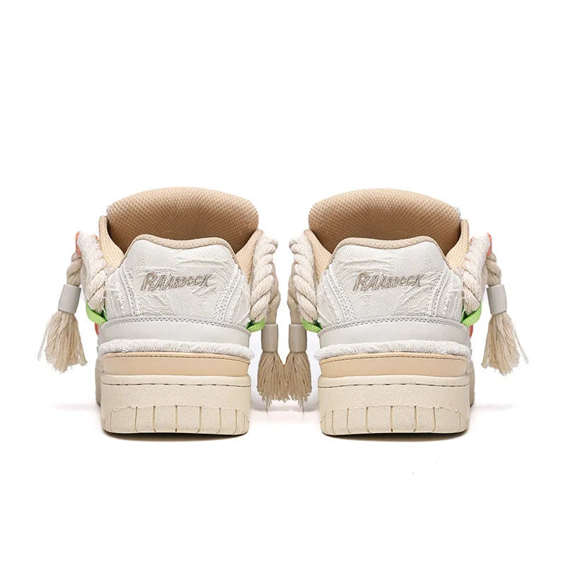 Creamy white Old Damage retro lace-up skateboard shoes with platform sole on a plain background.