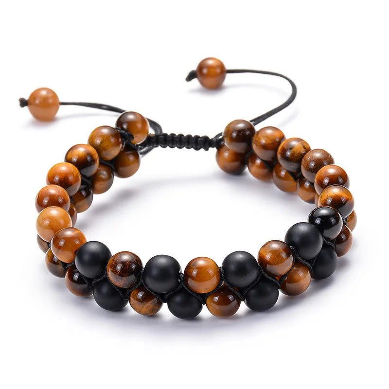 Geometric couple bracelet made of matte black agate beads with a tiger eye stone.