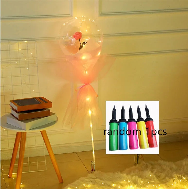 Transparent LED luminous balloon bouquet with artificial rose and glowing light inside, displayed as a DIY kit.
