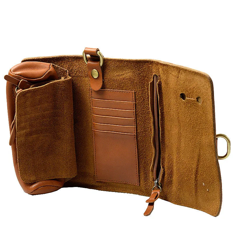 Handmade cow leather vintage wallet in black, showing tape extraction closure, 20cm long.