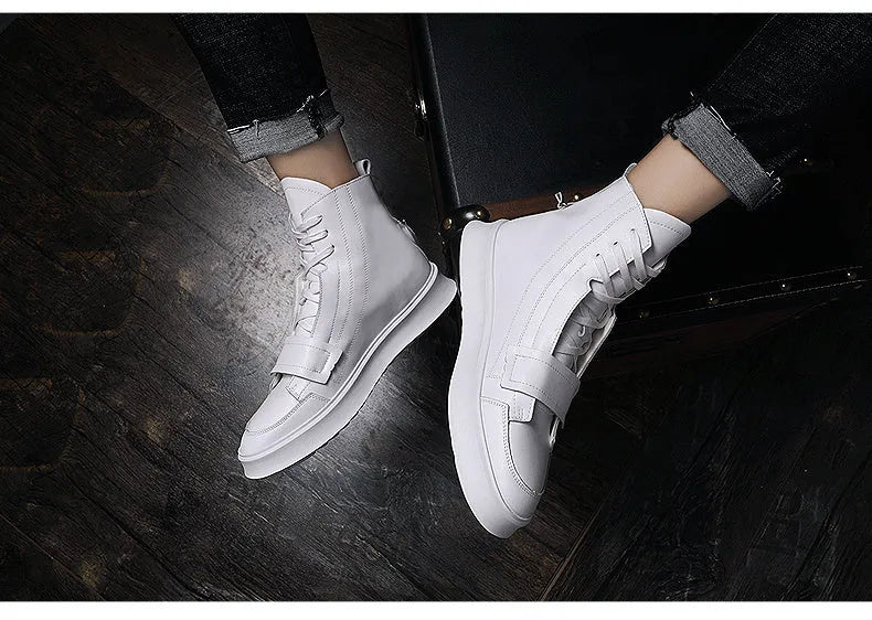 Man wearing black PU leather high-top sneaker style winter ankle boots.