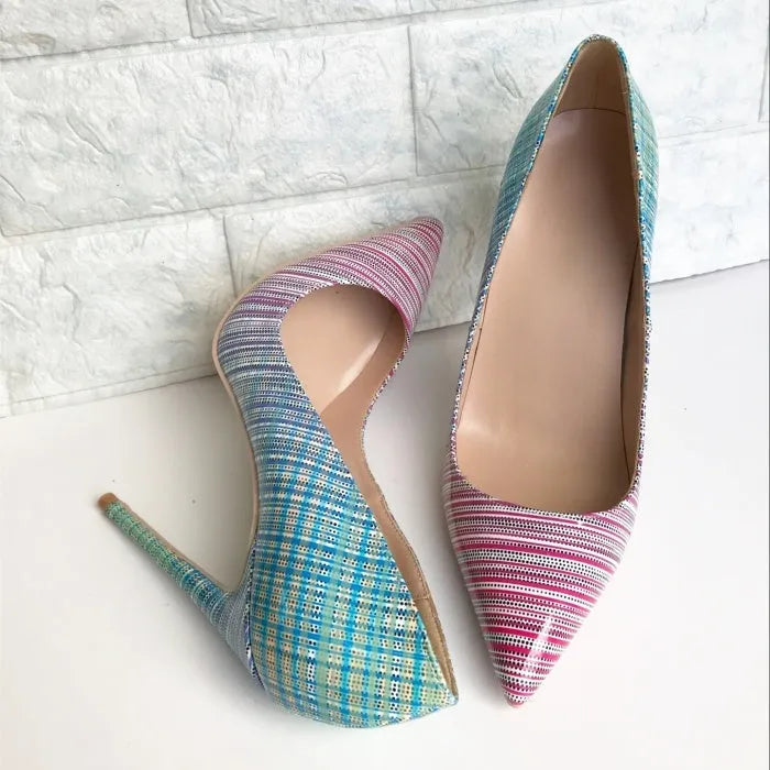 Ladies high heel shoes with a pink to blue gradient colour, pointed toe, and a tall thin heel.