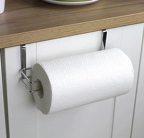 Silver stainless steel paper towel rack mounted on kitchen cabinet door