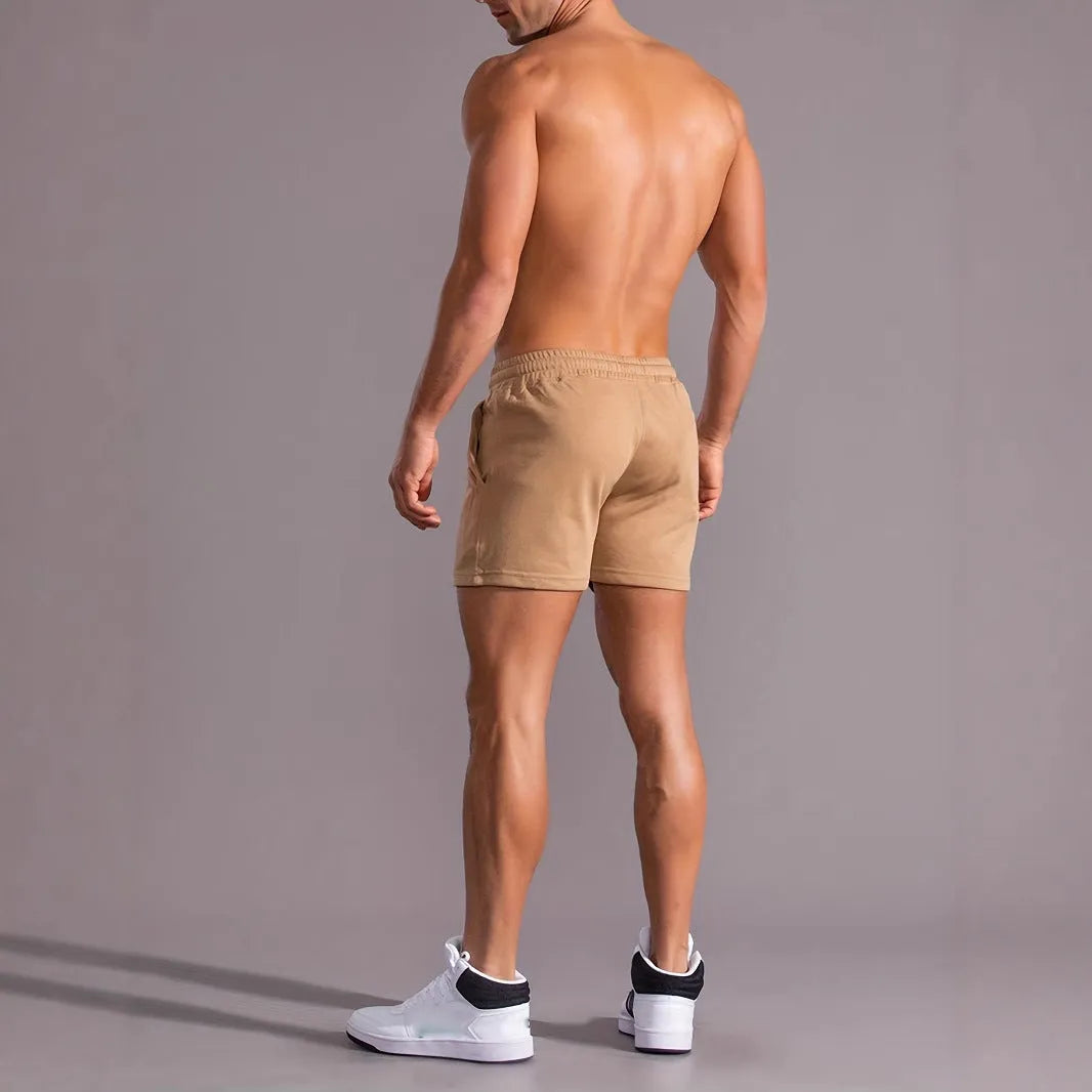 Men's khaki sports shorts with coconut print pattern showing straight cut and micro-elastic polyester fabric