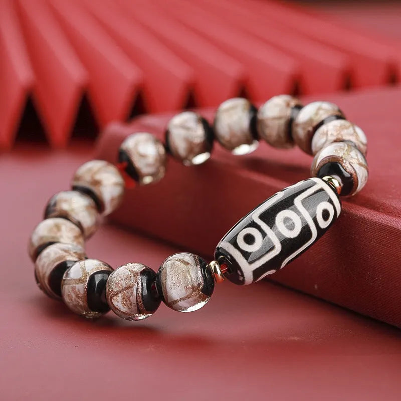 Chinese-style coloured glaze bracelet with five-colour design and Year of the Snake lucky beads.