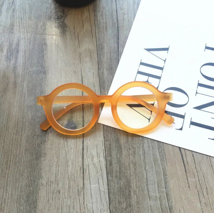 Retro round plastic frame glasses with anti-blue light filter in black, pink, leopard, red, white, or yellow.