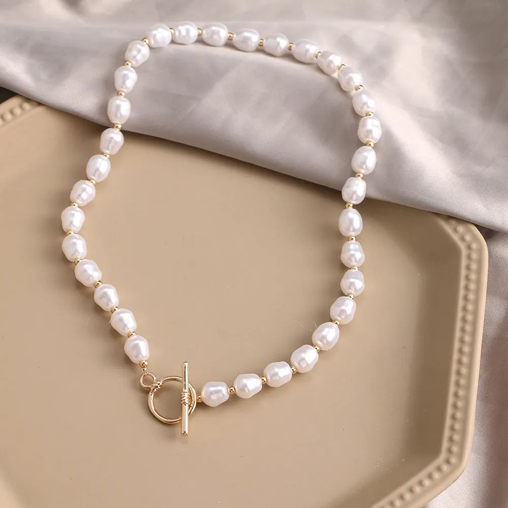 Vintage heart-shaped alloy necklace with pearl chain and electroplated gold finish