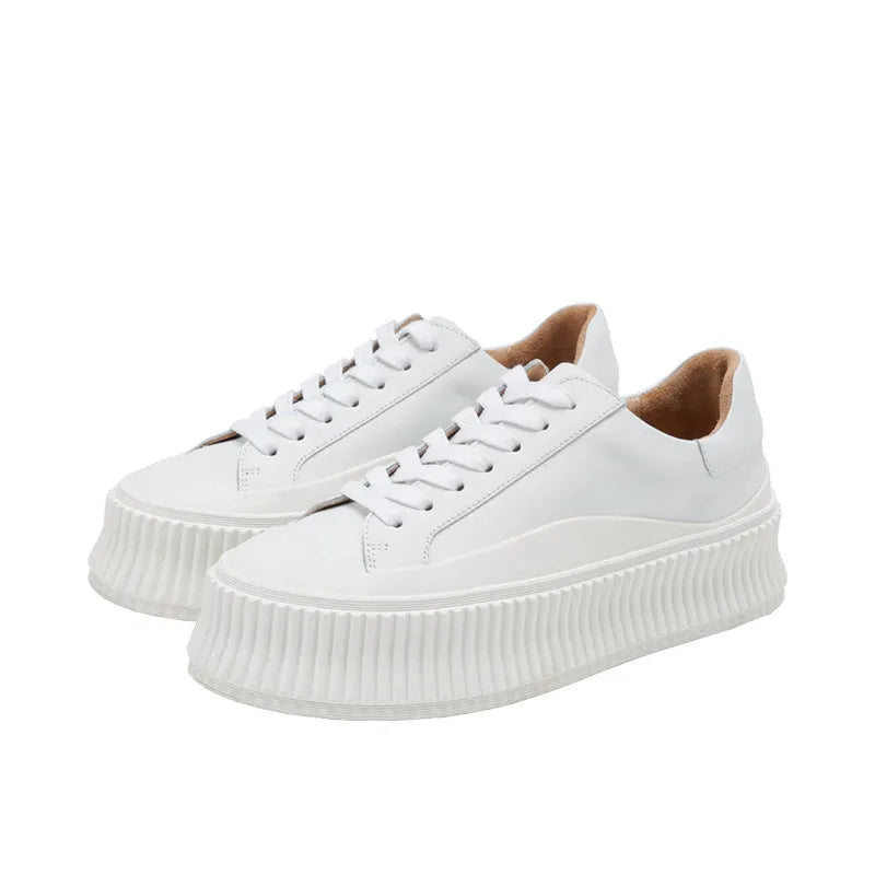 Women's white thick sole sneakers with cow suede upper and cross binding detail