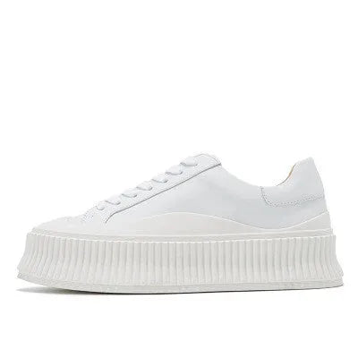 Women's white thick sole sneakers with cow suede upper and cross binding detail