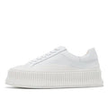 Women's white thick sole sneakers with cow suede upper and cross binding detail