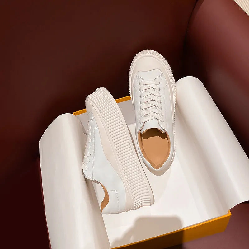 Women's white thick sole sneakers with cow suede upper and cross binding detail