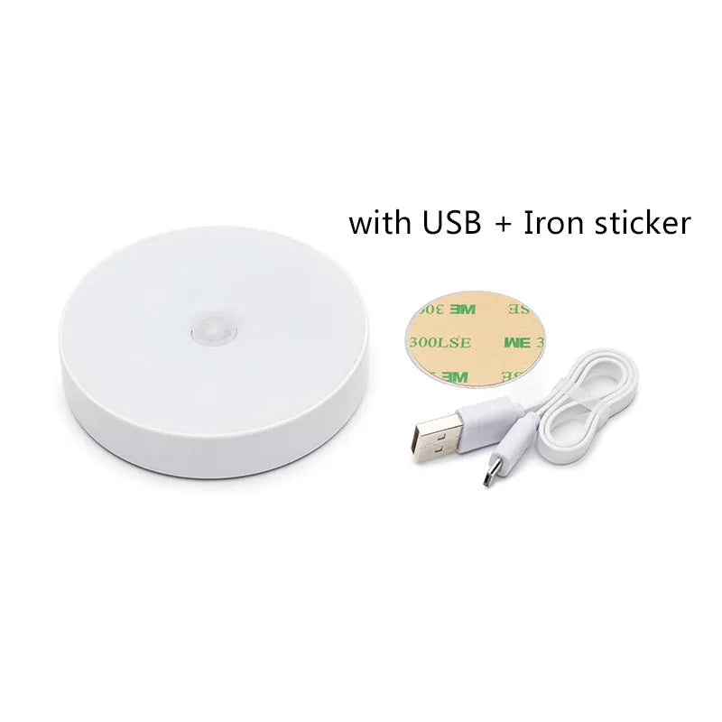 White USB rechargeable LED body induction night light with adhesive backing showing 86mm diameter