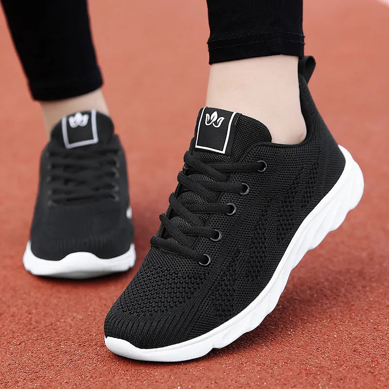 Women's white high-top casual shoe with flat board tide shoe design and back lacing.