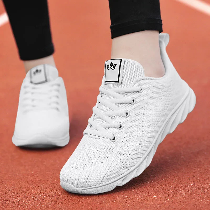 Women's white high-top casual shoe with flat board tide shoe design and back lacing.