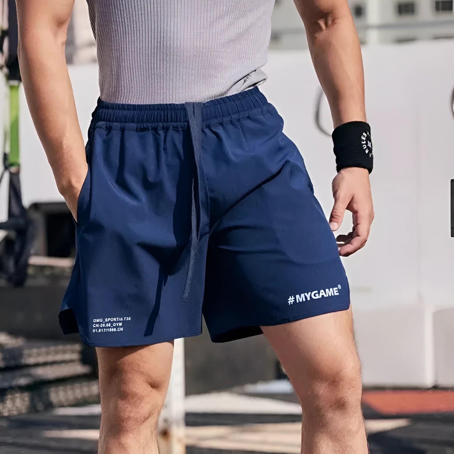 Men's grey quick-dry fitness shorts with a short-length cut for summer training.