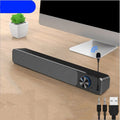 Black and white desktop computer speaker with wired audio connection and 2.0 channel stereo output