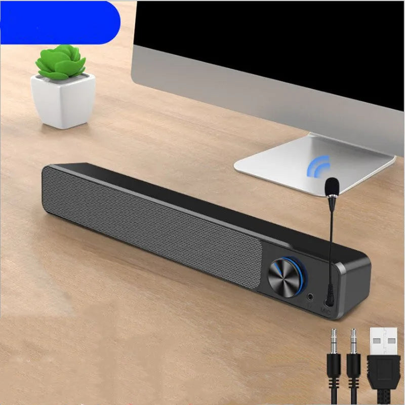 Black and white desktop computer speaker with wired audio connection and 2.0 channel stereo output