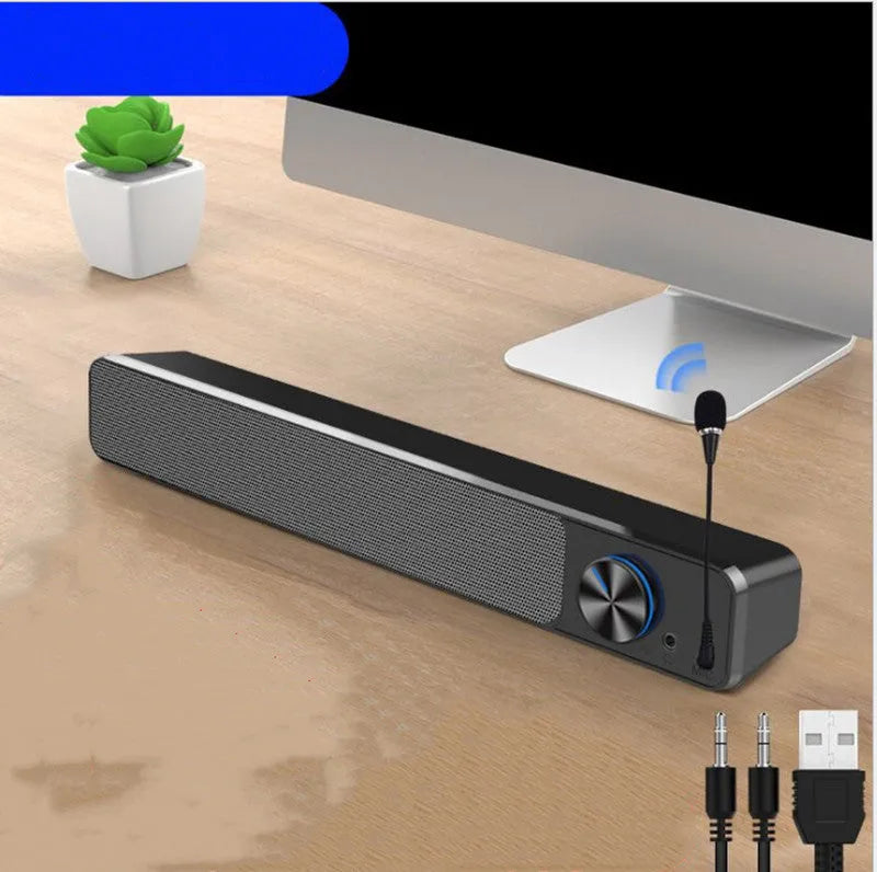Black and white desktop computer speaker with wired audio connection and 2.0 channel stereo output