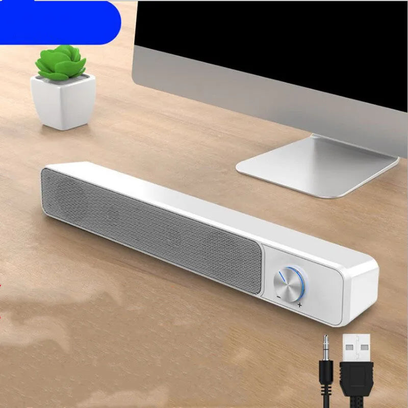 Black and white desktop computer speaker with wired audio connection and 2.0 channel stereo output