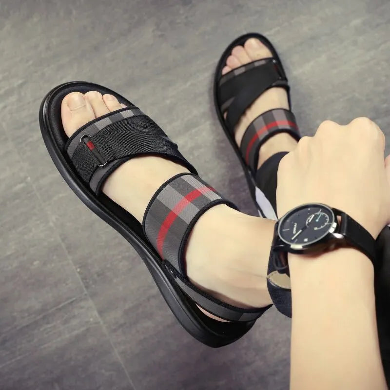 A pair of leisure-style sandals with a Lycra upper and Polyurethane sole for youth summer wear.