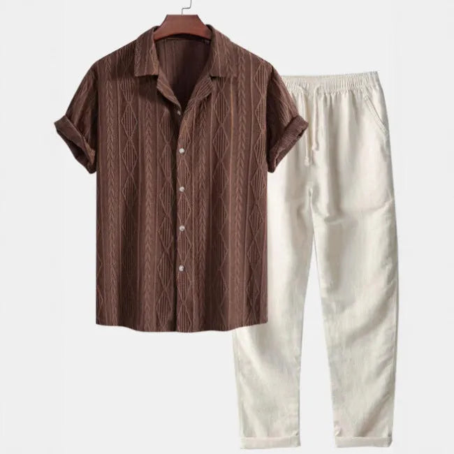 Men's casual camouflage print cardigan suit with short sleeve shirt and trousers on a hanger.