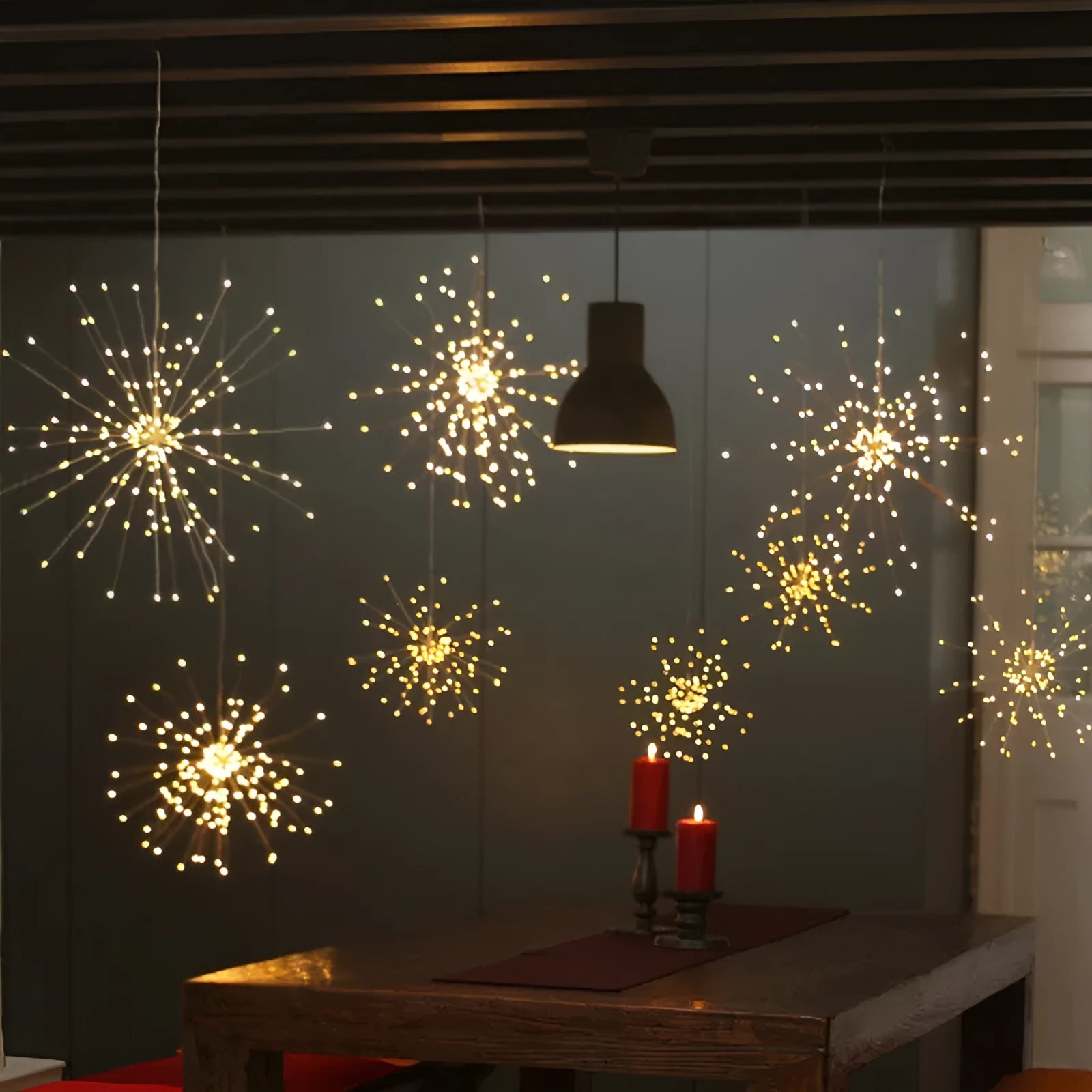 Solar LED meteor shower light with remote control showing warm white starry explosion effect