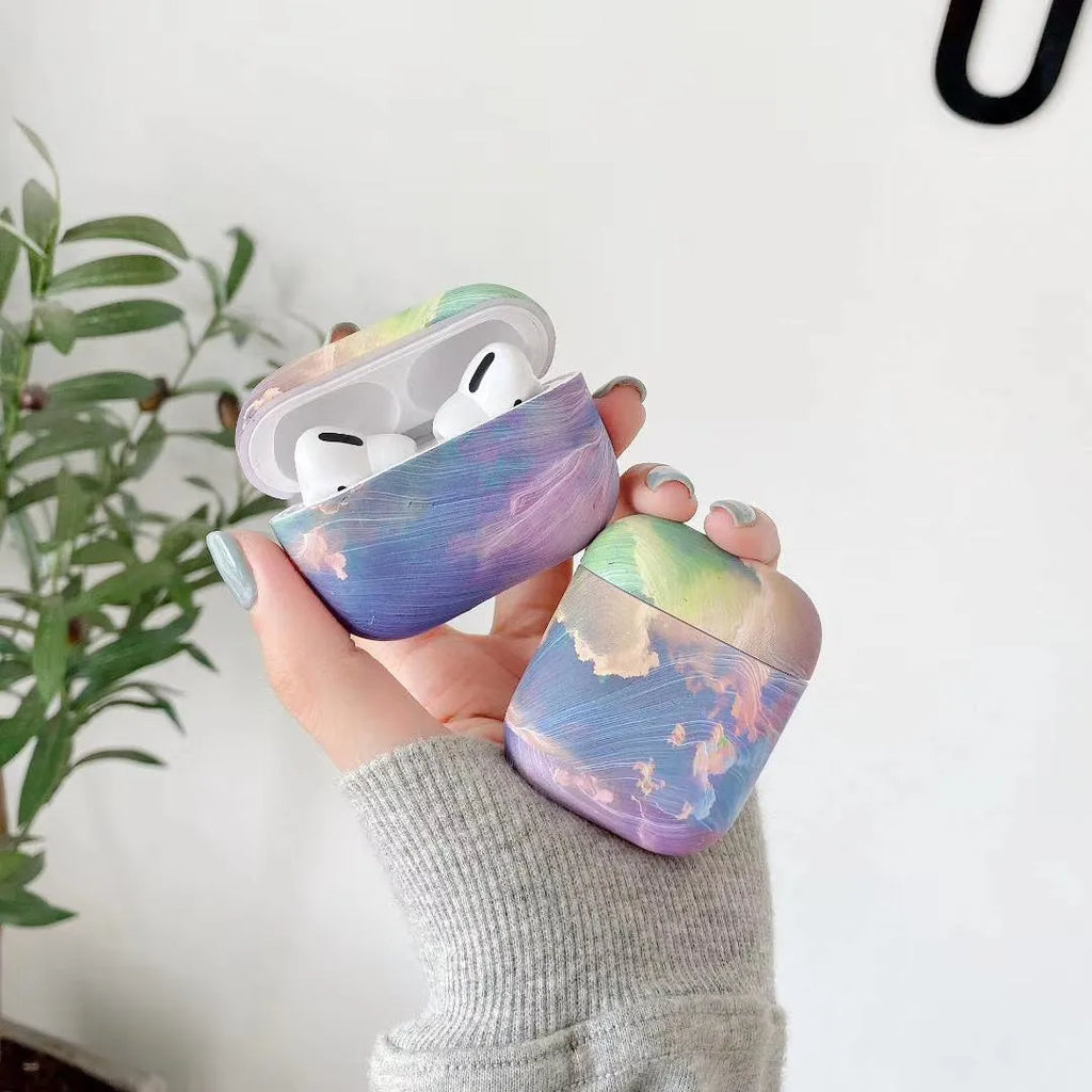 Hard plastic protective sleeve for Apple AirPods case in a blue watercolour design.