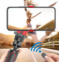 Black aluminium iPhone tripod with extended legs and phone clamp, showing integrated video balance stabiliser unit