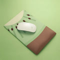 Kiwi-shaped mouse pad with green graphic on a thick, soft wrist support surface.