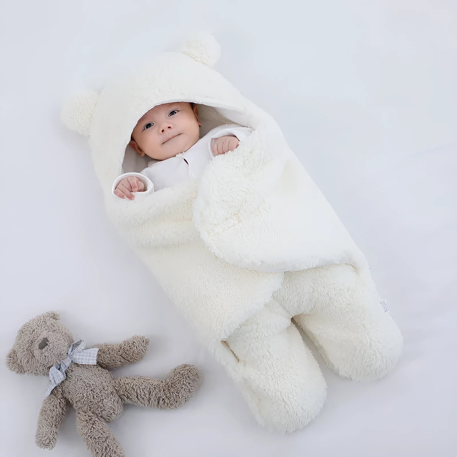 Cotton blend quilted baby sleeping bag wrapper in light blue, shown laid flat.